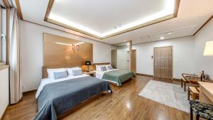 Postel nebo postele na pokoji v ubytování Venezia Hotel