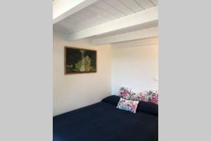 A bed or beds in a room at La Casetta