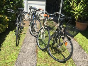 three bikes parked in front of a house at Villa Feltran in Forte dei Marmi