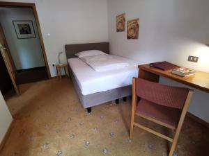 Una cama o camas en una habitación de Garni Weghueb