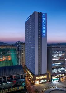 a tall building in a city at night at Toyoko Inn Incheon Bupyeong in Incheon