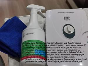 a bottle of cleaner next to a box of cleaning wipes at Lubawskie Zacisze in Lubawka