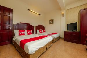 Säng eller sängar i ett rum på Sunlight Hotel Hạ Long