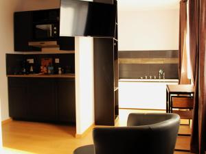 Kuchyň nebo kuchyňský kout v ubytování Appart Hotel Relax Spa