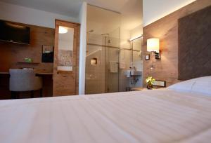Postel nebo postele na pokoji v ubytování Hotel-Restaurant am Hochfuchs