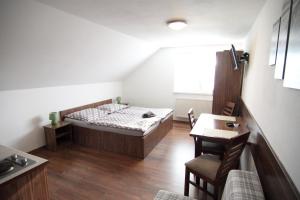 Posteľ alebo postele v izbe v ubytovaní Apartmánový dom Stela