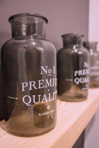 two glass jars sitting on a wooden shelf at Cal Tomaset in Prades