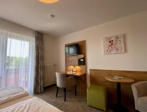 Postel nebo postele na pokoji v ubytování Hotel-Restaurant am Hochfuchs