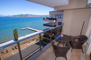 a balcony with a table and a view of the ocean at Park Diamond Apartments in Ohrid