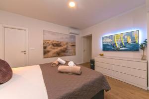 Postel nebo postele na pokoji v ubytování Apartman Macan