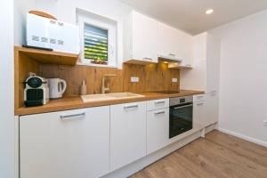 Kuchyň nebo kuchyňský kout v ubytování Apartman Macan