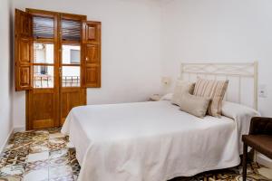 Posteľ alebo postele v izbe v ubytovaní Casa rural la ermita de Anna
