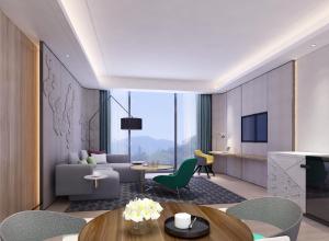 a living room with a couch and a table at Holiday Inn Guangzhou South Lake, an IHG Hotel in Guangzhou
