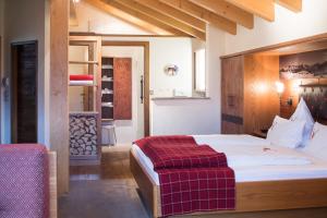 Postel nebo postele na pokoji v ubytování Hotel Leitner