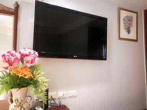 A television and/or entertainment center at Diamond City Hotel SHA Certified