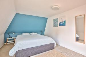 Una cama o camas en una habitación de Appart' Grand'Place