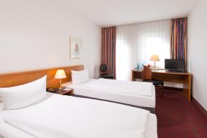 Postel nebo postele na pokoji v ubytování ACHAT Hotel Darmstadt Griesheim