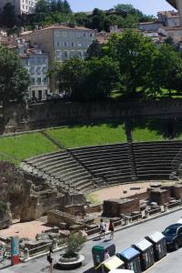 a view of an amphitheater with people walking on the street at The Gallery Boutique Rooms in Trieste