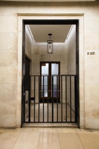 an entrance to a building with a gate at The Gallery Boutique Rooms in Trieste