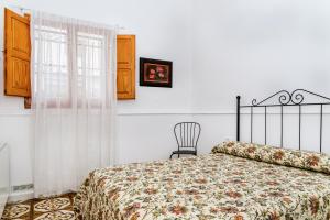 Posteľ alebo postele v izbe v ubytovaní Casa rural la ermita de Anna