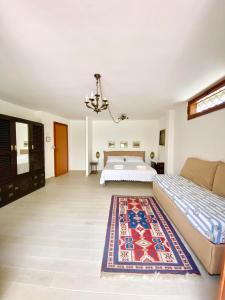 Posteľ alebo postele v izbe v ubytovaní La depandance di Villa Rosa locazioni brevi