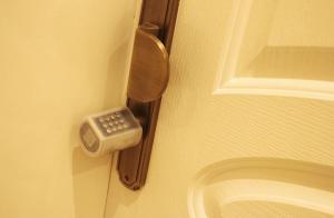 a door with a cell phone on the wall at A - 369 مقابل الراشد مول in Abha +23 photos