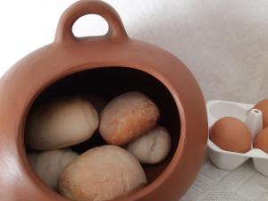 a pot full of eggs and a bunch of mushrooms at Le Stanze di Patika in Tortolì