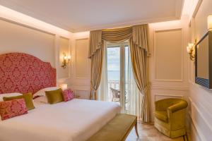 Postel nebo postele na pokoji v ubytování Grand Hotel Excelsior Vittoria
