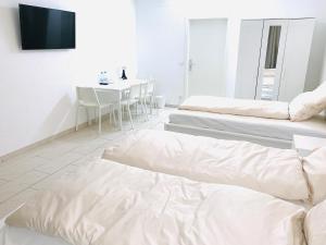 En eller flere senge i et værelse på Gemütliches Zimmer 20 min vom Frankfurt HBF 1