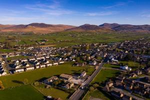 an aerial view of a small village in the mountains at Cleomack View, Annexe apartment with Hot Tub in Hilltown