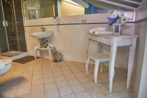 a bathroom with a sink and a toilet and a sink at Vecchio Granaio in Pisa
