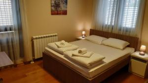 Letto o letti in una camera di Pilon apartments