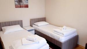Letto o letti in una camera di Pilon apartments