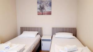 Letto o letti in una camera di Pilon apartments