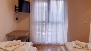 Letto o letti in una camera di Pilon apartments