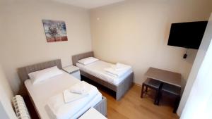 Letto o letti in una camera di Pilon apartments