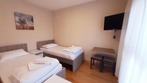 Letto o letti in una camera di Pilon apartments