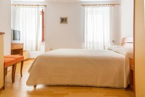 Postel nebo postele na pokoji v ubytování Rooms Anka + 14 fotografií