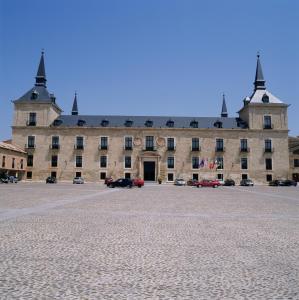 
a large building with a large clock on the side of it at Parador de Lerma in Lerma
