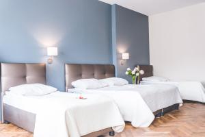 Posteľ alebo postele v izbe v ubytovaní Hotel Floryan Old Town