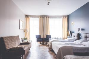 Posteľ alebo postele v izbe v ubytovaní Hotel Floryan Old Town