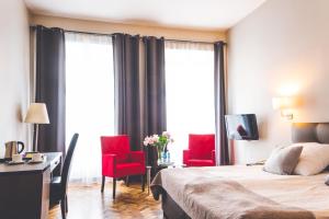 Posteľ alebo postele v izbe v ubytovaní Hotel Floryan Old Town