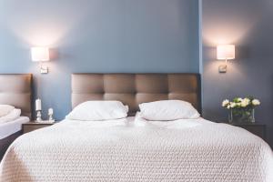 Posteľ alebo postele v izbe v ubytovaní Hotel Floryan Old Town