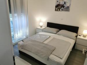 Posteľ alebo postele v izbe v ubytovaní Apartmani Eden Vrsi Mulo