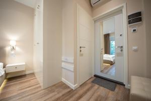 a room with a door leading to a bedroom at Современный минимализм в центре Киева. in Kyiv +36 photos