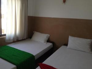 Letto o letti in una camera di Grand View Guesthouse