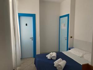 Letto o letti in una camera di Caravella
