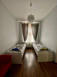 Posteľ alebo postele v izbe v ubytovaní Ametyst Apartments