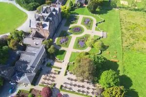 an aerial view of a building with a cross on the lawn at The Gardeners Cottage at Wells House in Glenranny