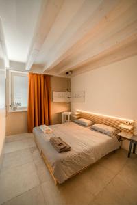 Postel nebo postele na pokoji v ubytování Le Scuderie B&B